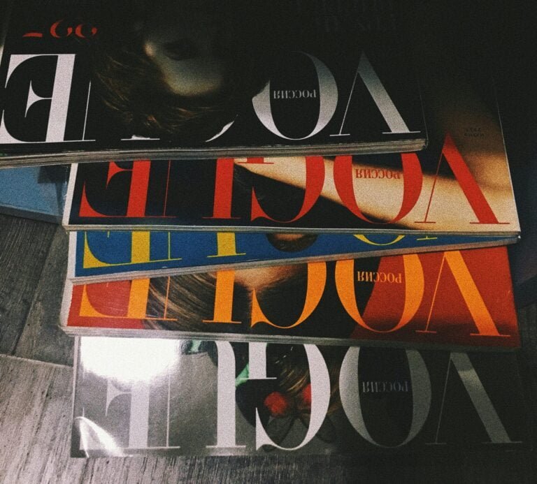 five assorted Vogue magazines